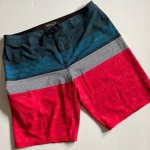 O’NEILL Hyperfreak red, white and blue striped board short.  Men’s size 36